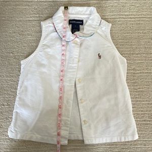 Girls sleeveless polo shirt size 6.  Good condition.